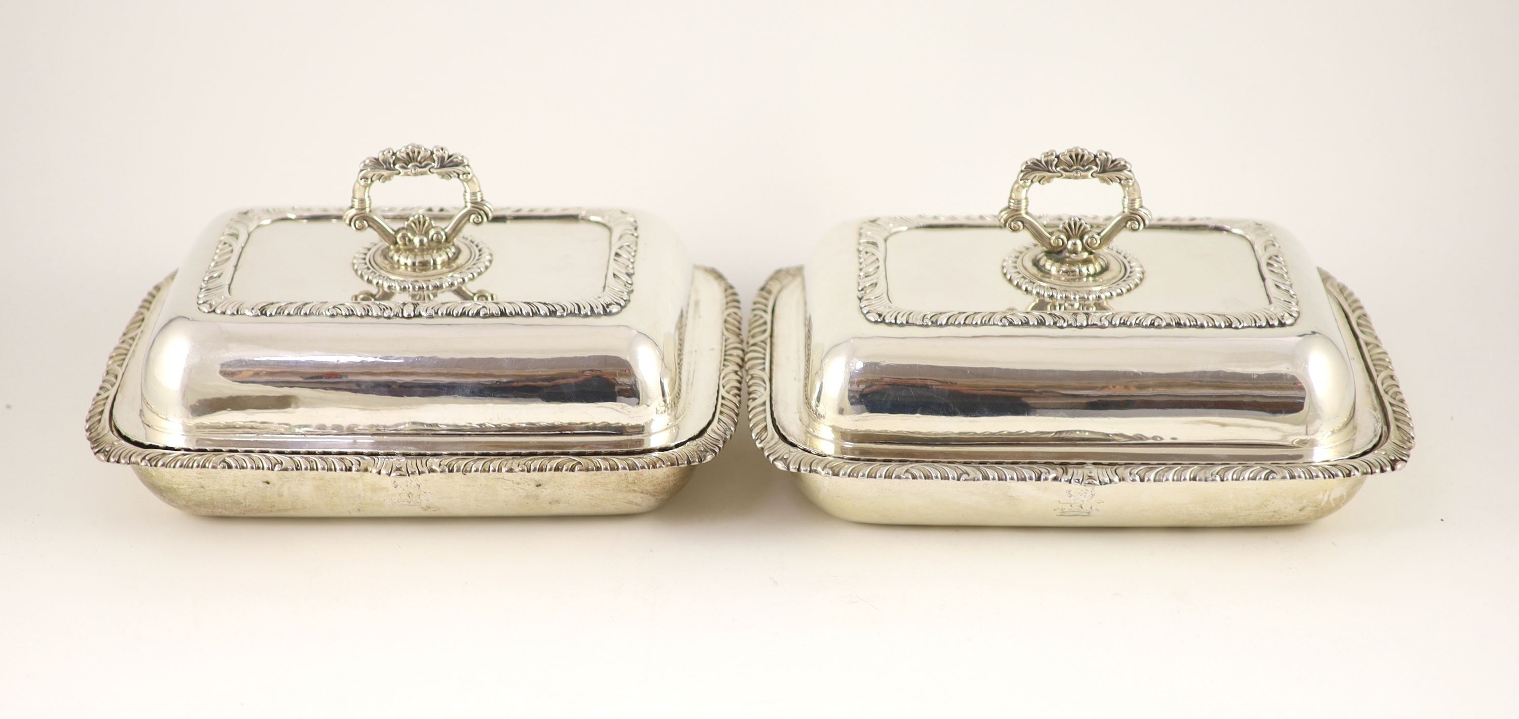 A pair of George III silver entrée dishes and covers, James Kirkby, Waterhouse & Co, Sheffield